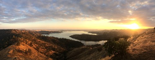sunset over mountans and lake near fresno