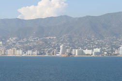 view of city of alcapulco mexico againt the mountains in the background